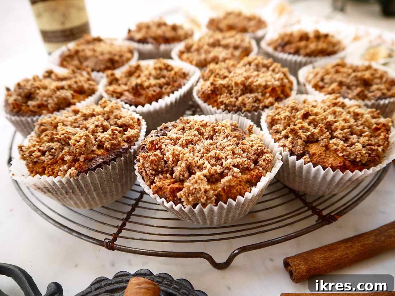 Gluten-Free Cinnamon Swirl Coffee Cake Muffins 5 Platter of freshly baked gluten-free coffee cake muffins arranged with a hot cup of coffee, ready to be served