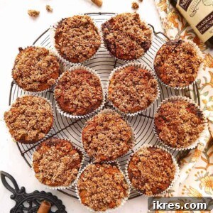 Gluten-Free Cinnamon Swirl Coffee Cake Muffins 6 Close-up of a single Gluten-free Cinnamon Coffee Cake Muffin on a white plate