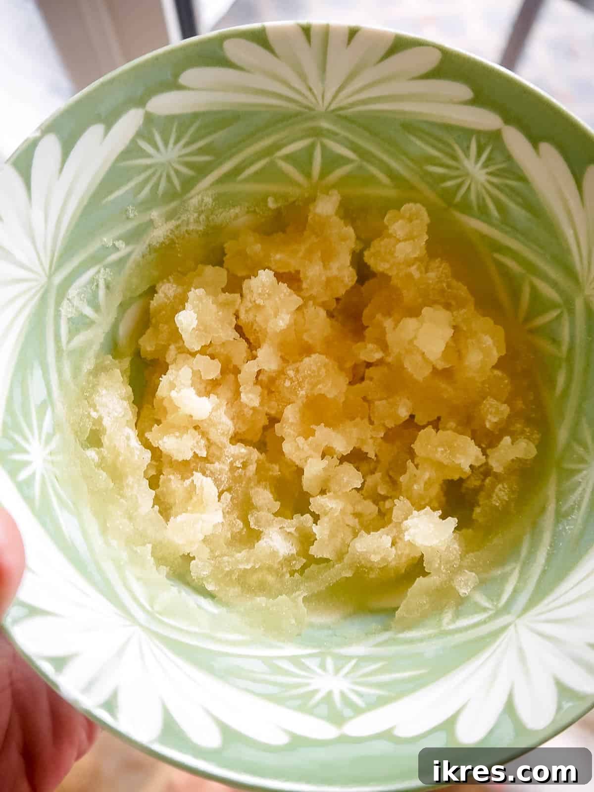 DIY Apple Gummy Delights 4 Gelatin powder being mixed into cold water in a bowl.