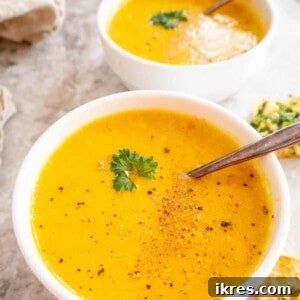 High protein butternut squash soup in two bowls.