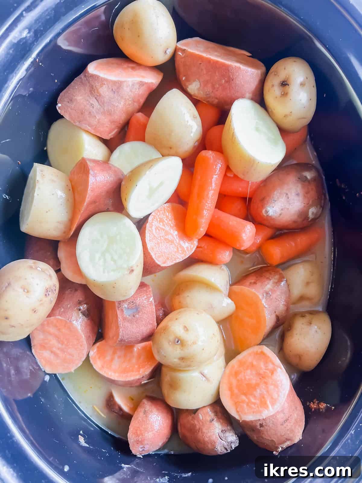 All remaining ingredients, including vegetables and broth, added to the slow cooker.