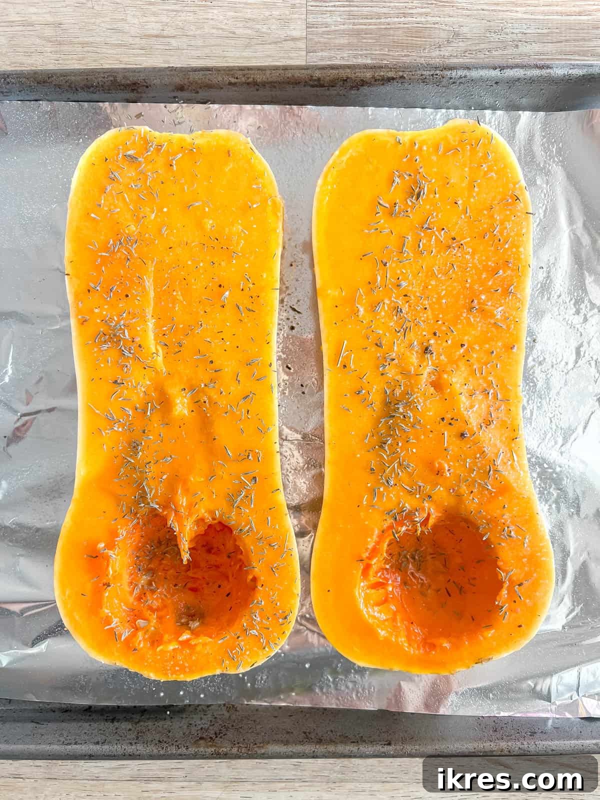 Velvety Butternut Squash and Carrot Soup 4 Butternut squash before baking, seasoned with olive oil, salt, pepper, and thyme.