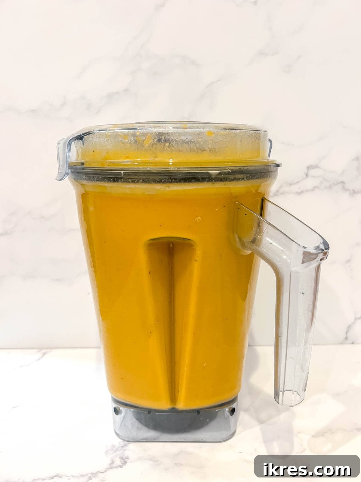 Velvety Butternut Squash and Carrot Soup 9 The soup in a blender after being mixed until smooth.