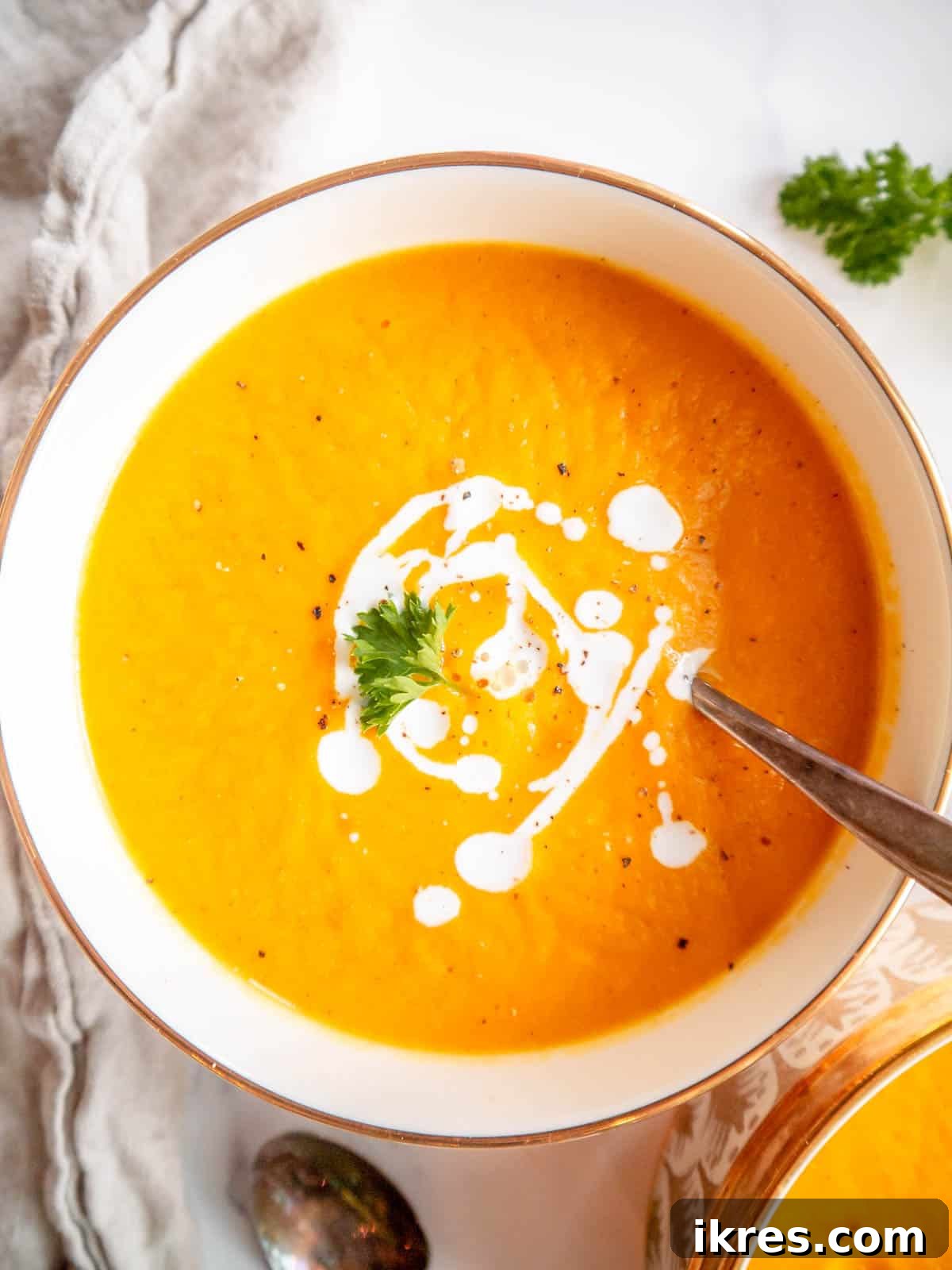 Velvety Butternut Squash and Carrot Soup 10 Butternut squash and carrot soup in a bowl, ready to be served.
