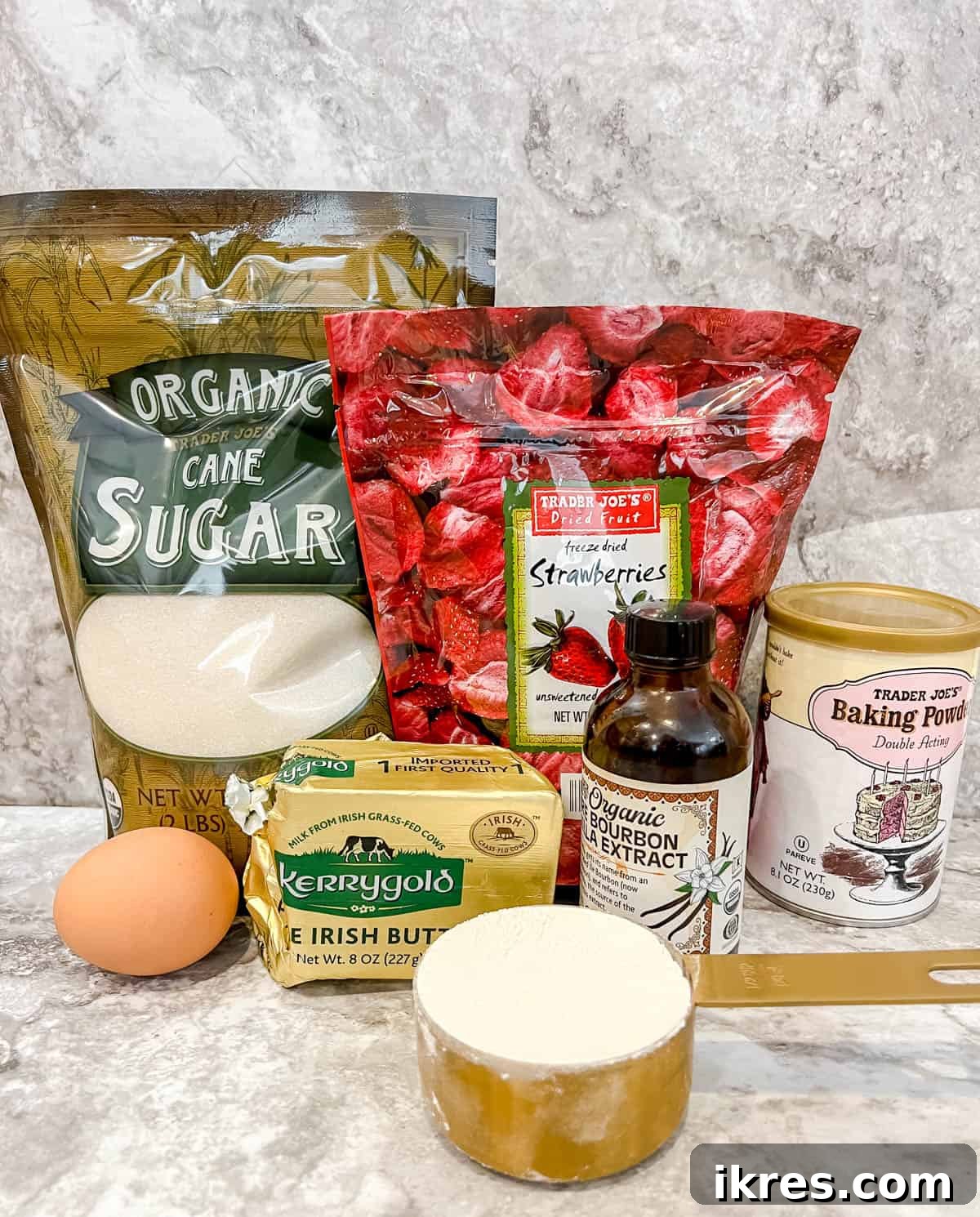 Homemade Small Batch Strawberry Cupcakes 3 Ingredients needed to make strawberry cupcakes, including flour, sugar, eggs, and freeze-dried strawberries.