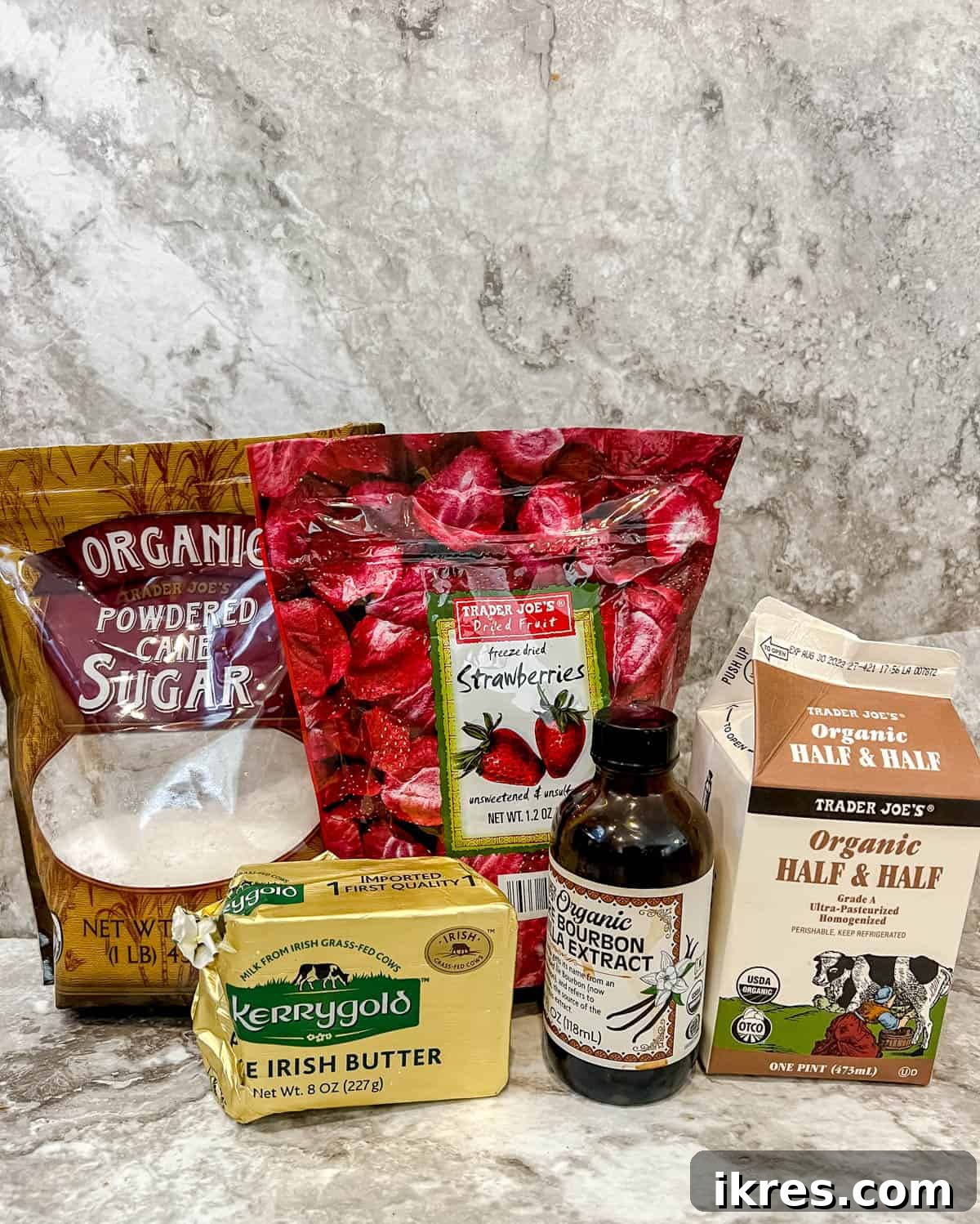 Homemade Small Batch Strawberry Cupcakes 4 Ingredients needed to make strawberry frosting, including powdered sugar, butter, and freeze-dried strawberries.