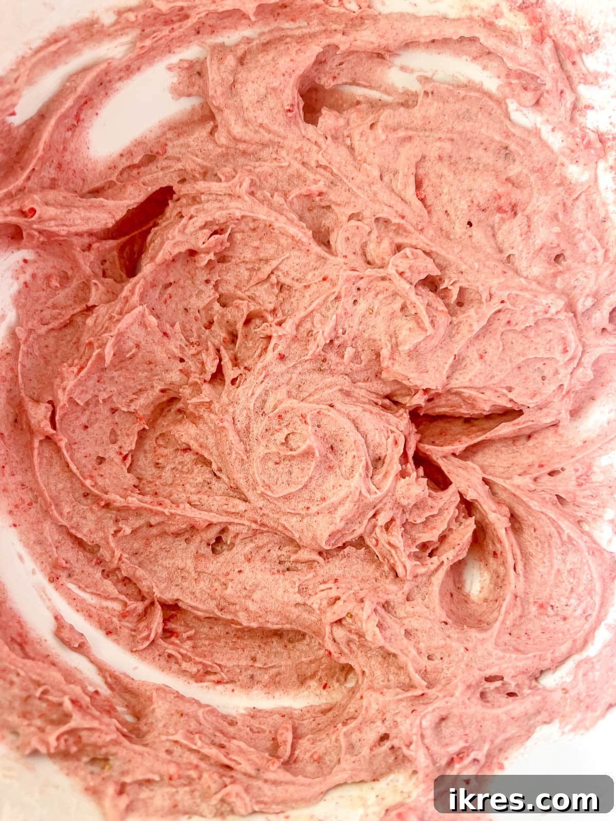 Homemade Small Batch Strawberry Cupcakes 8 Strawberry cupcake batter in a bowl, showing its soft pink color and smooth consistency.