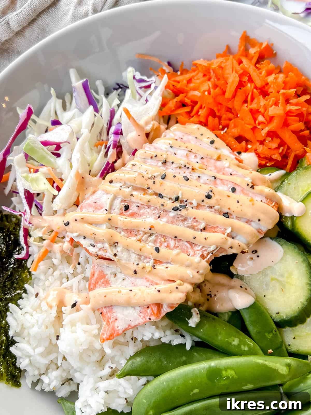 A beautifully presented salmon rice bowl, showcasing the vibrant colors and textures, inspired by popular food trends.