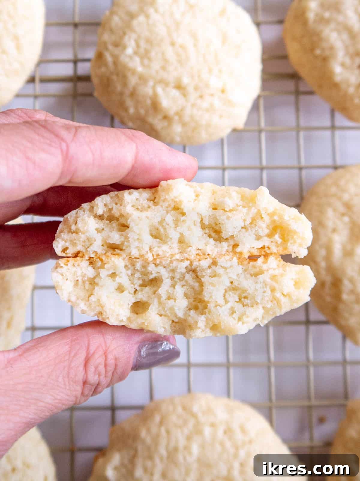 Pillowy Cottage Cookies 2 A perfectly baked cottage cheese cookie, cut in half to reveal its soft, cake-like interior.