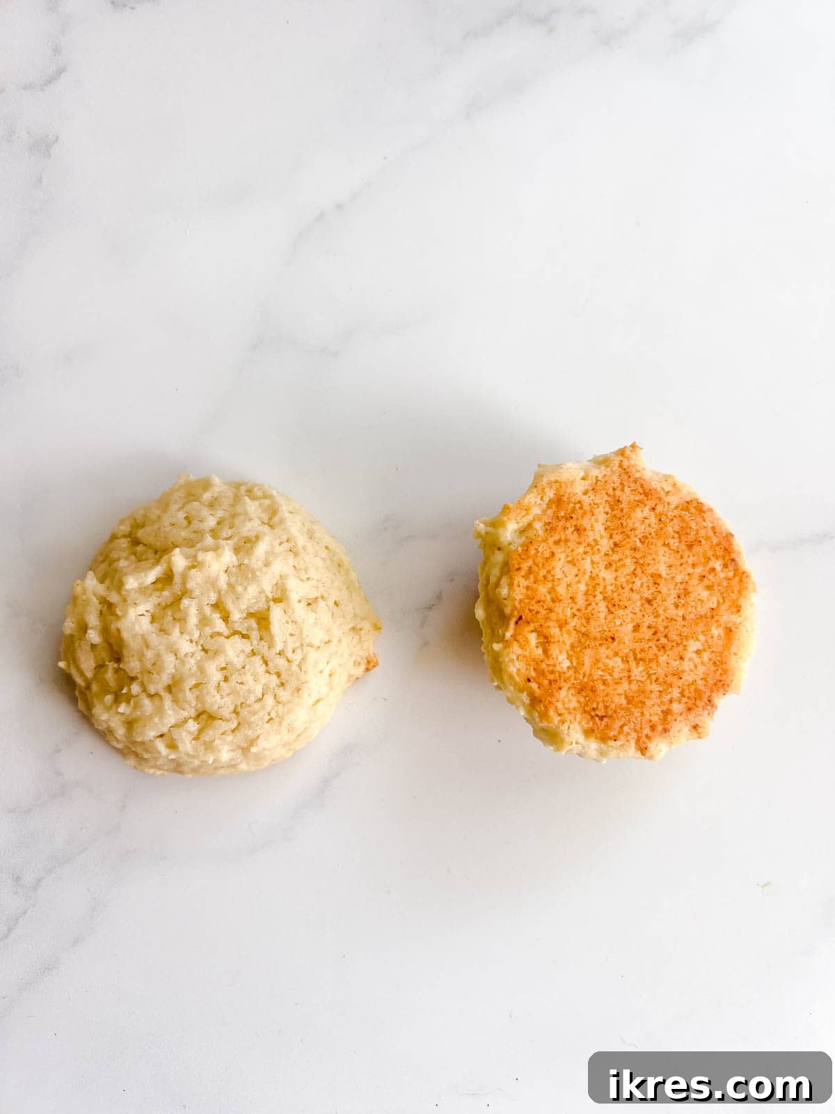 Pillowy Cottage Cookies 13 The underside of a perfectly baked cottage cheese cookie, showing a light golden brown color.