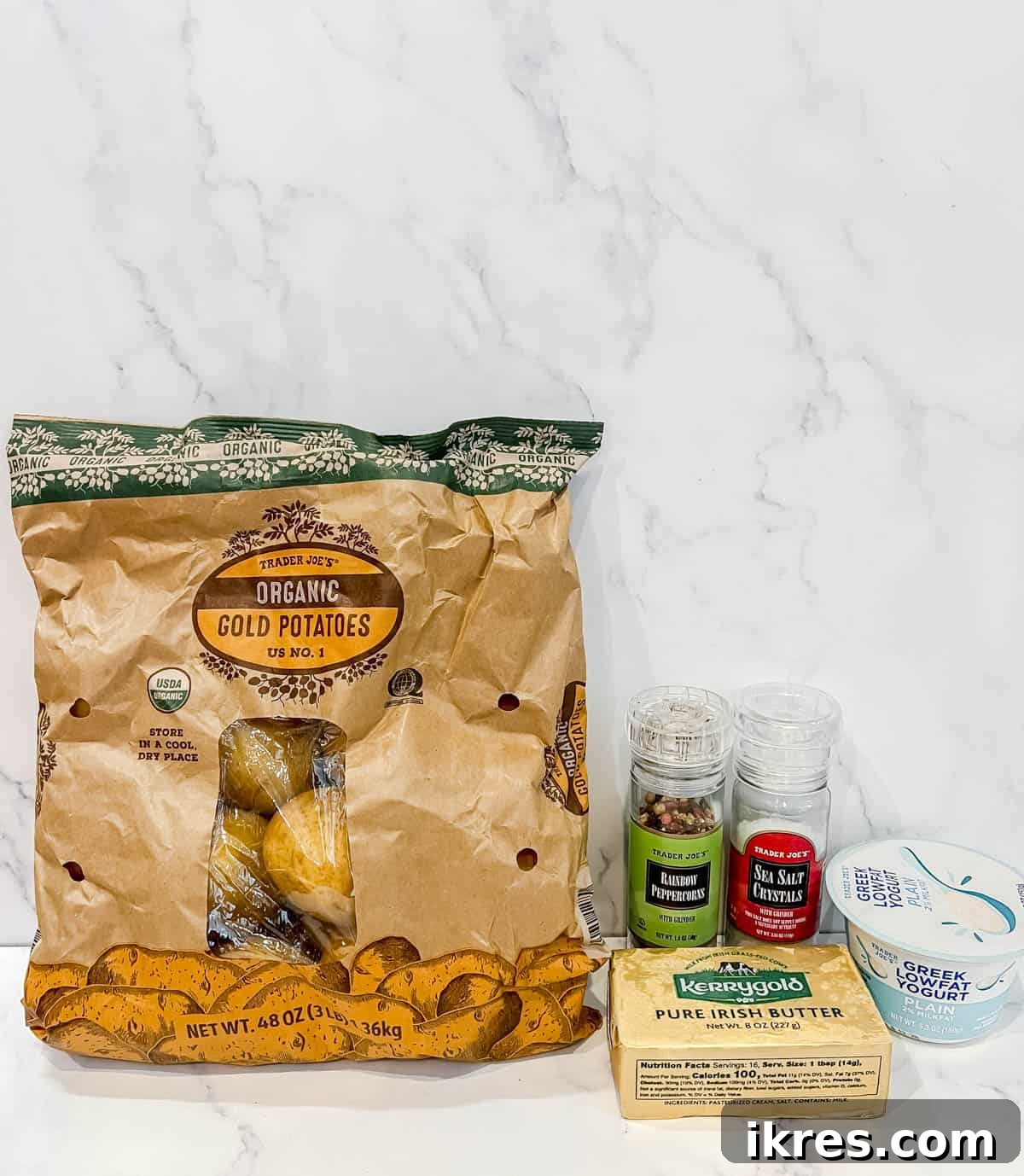 Ingredients needed to make creamy Greek yogurt mashed potatoes, laid out on a kitchen counter.