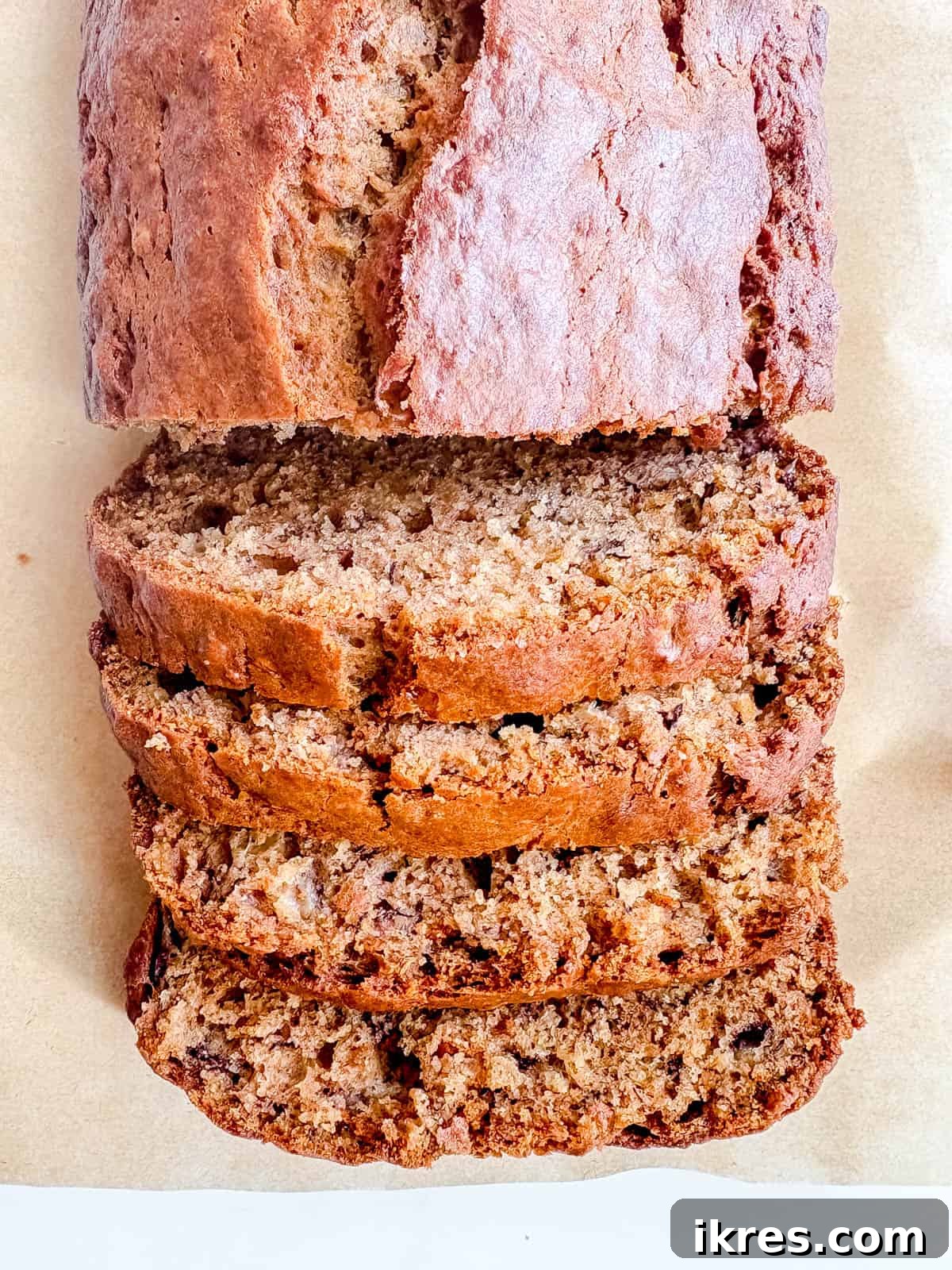 Golden Olive Oil Banana Bread 9 Beautifully cut slices of dairy-free banana bread made with olive oil, showcasing its moist and fluffy texture.
