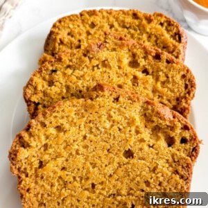 Autumn Spiced Dairy-Free Pumpkin Bread 11 A beautiful loaf of dairy-free pumpkin bread, perfectly baked and ready to be sliced.
