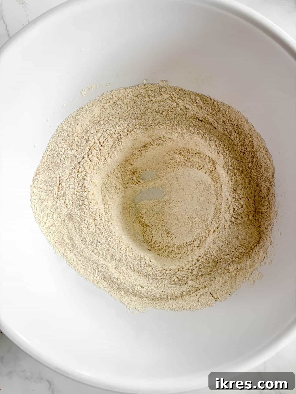 Autumn Spiced Dairy-Free Pumpkin Bread 5 A perfectly formed well or hole created in the center of the mixed dry ingredients.