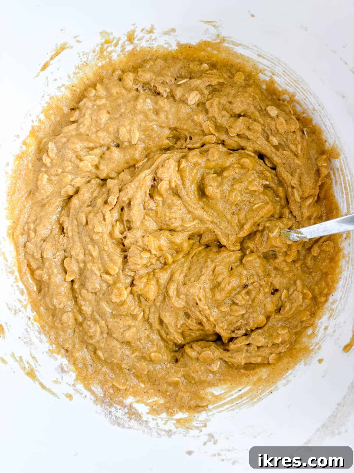 Plant-Based Pumpkin Spice Oat Muffins 6 Pumpkin oat muffin batter in a bowl after combining wet and dry ingredients.