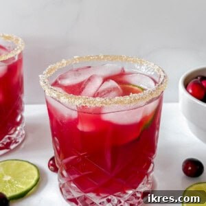 Cranberry margaritas cocktail with sugar on the rim.