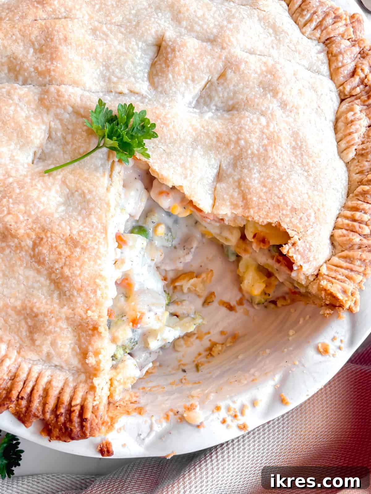 A perfect slice of chicken pot pie removed from the pan, showcasing its layers.