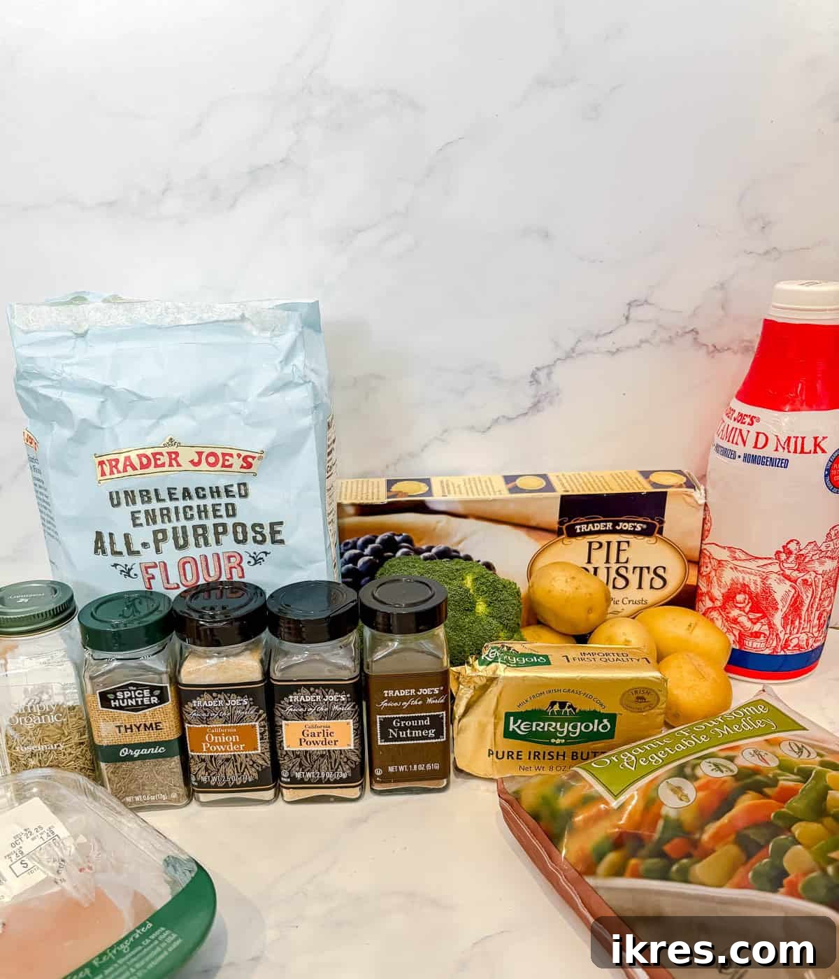 All the fresh and pantry ingredients laid out for making chicken pot pie with store-bought crust.