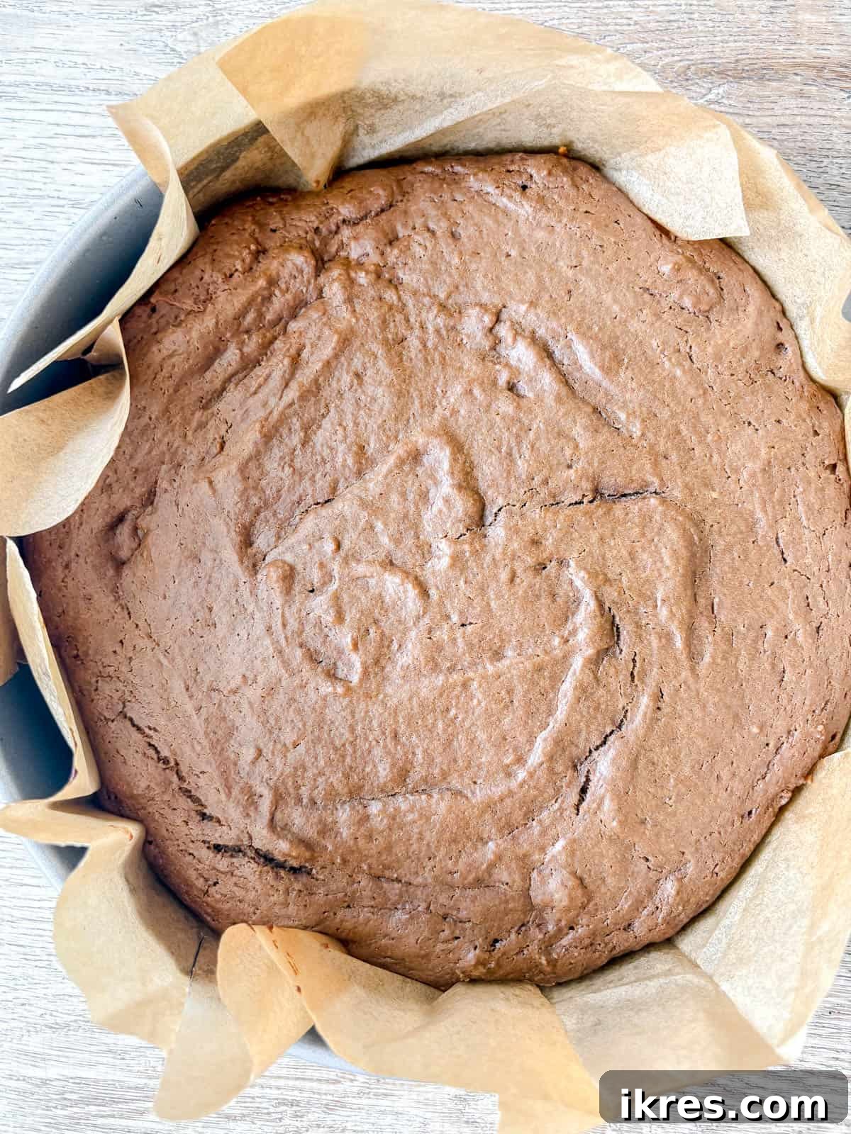 Spiced Gingerbread Cake with Tangy Cinnamon Cream Cheese Frosting 10 Baked Gingerbread Cake, golden brown and perfectly risen, cooling on a wire rack.