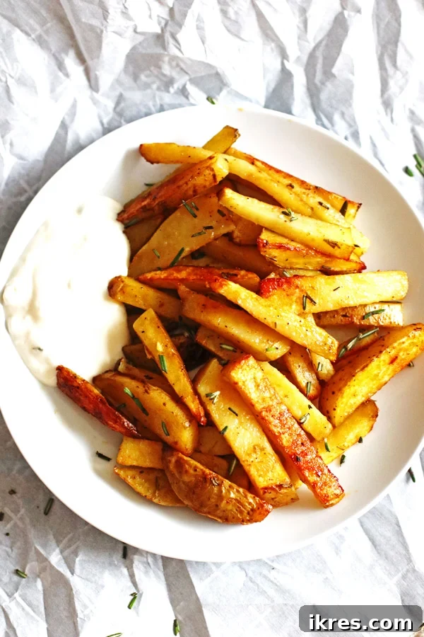 Crispy Oven Fries 3 Delicious and easy homemade oven baked French fries, ready to be served.