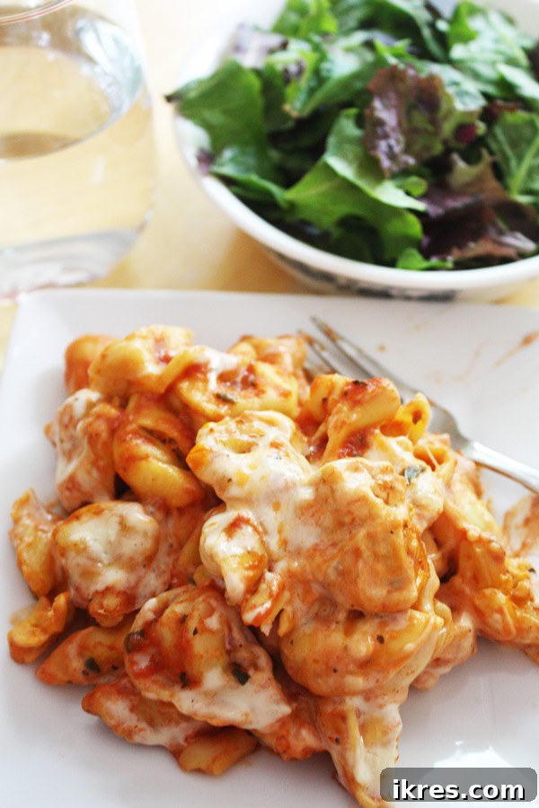 Close-up of a serving of Easy Cheesy Baked Tortellini, warm and ready to eat