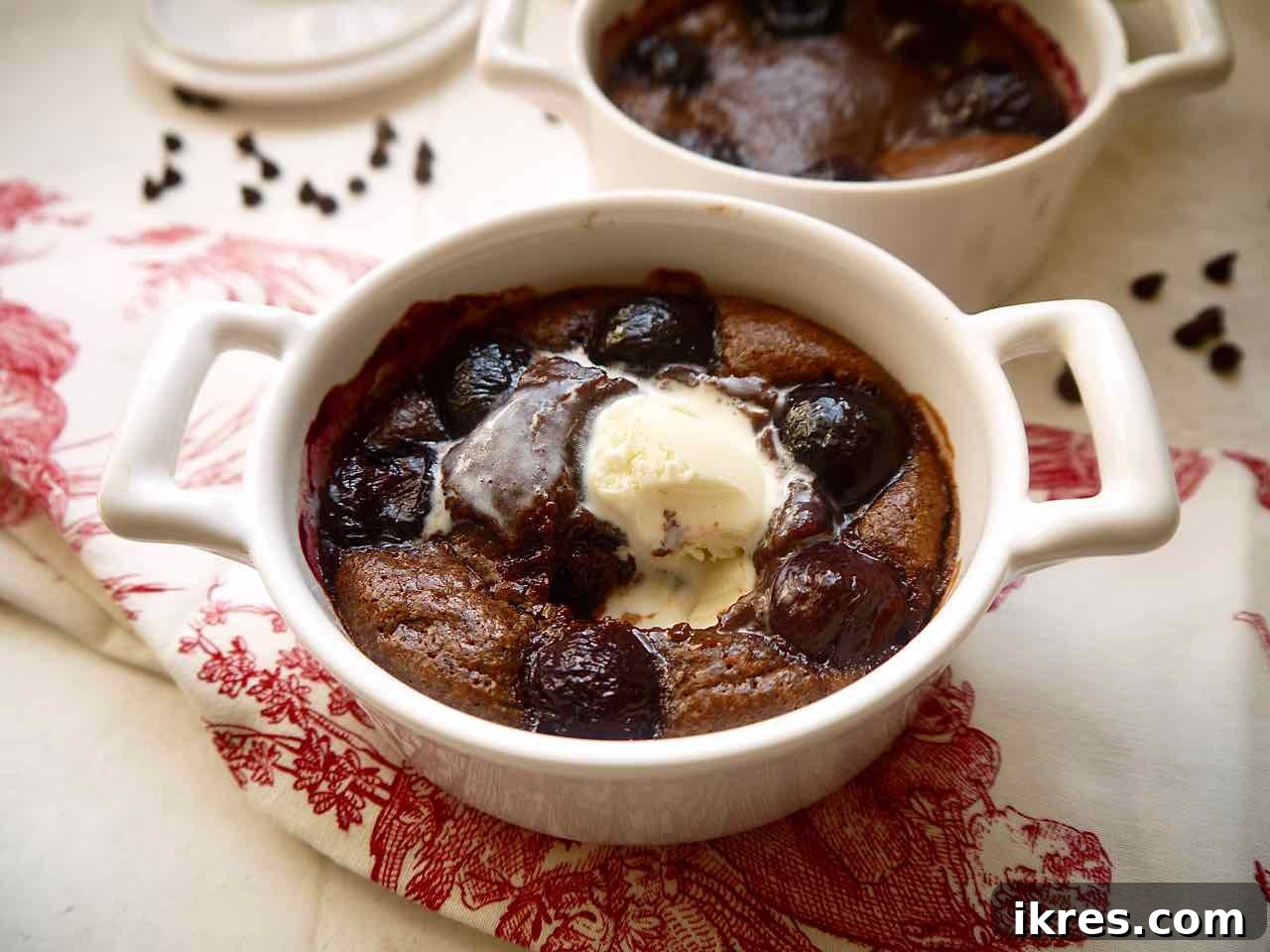 Freshly baked Almond Flour Chocolate Cherry Lava Cakes with ice-cream melting on it, ready to be enjoyed.