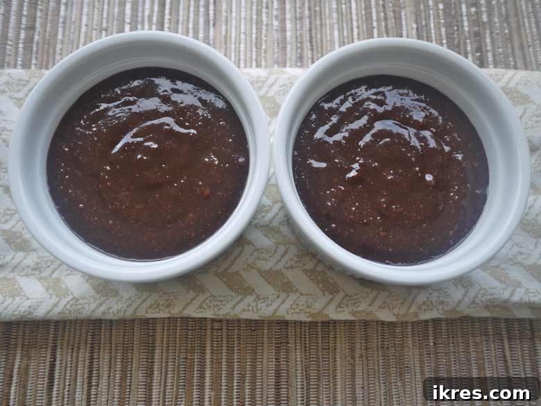 Almond flour, vanilla, and salt added to the chocolate mixture, then poured into ramekins.