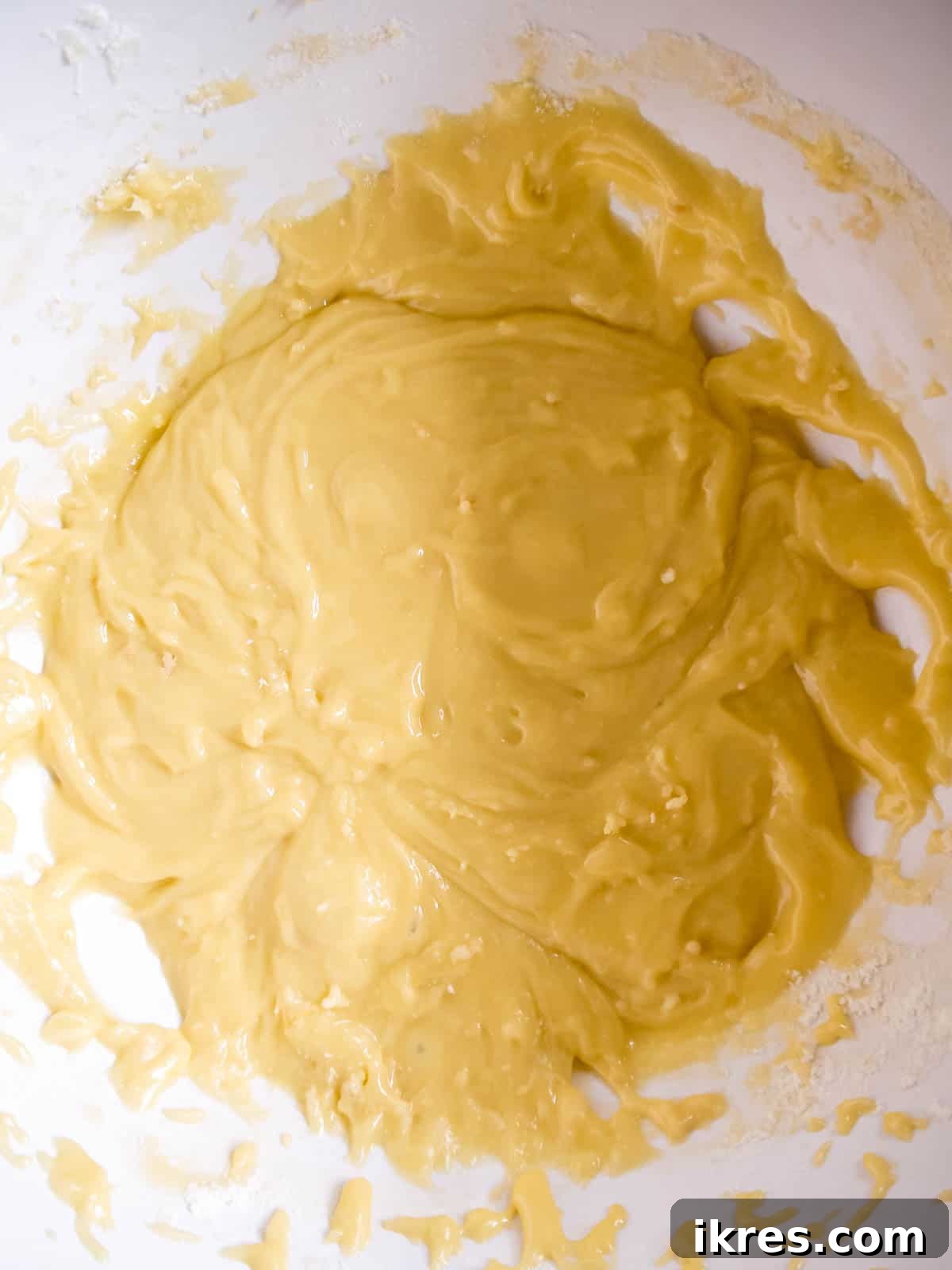 The smooth white chocolate brownie batter in a mixing bowl.