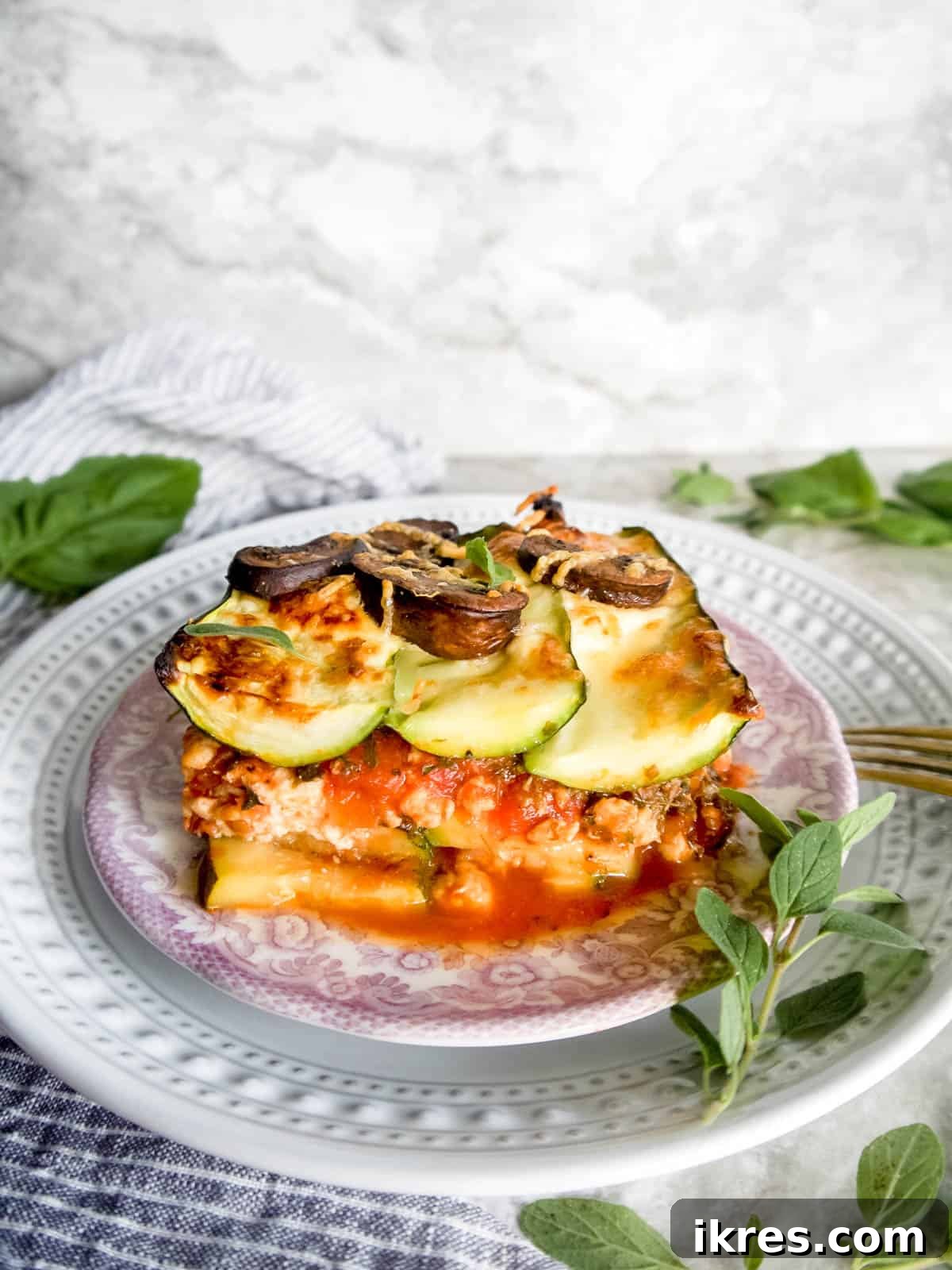Zucchini Lasagna Reimagined: Gluten-Free, Meaty, and Mushroom Packed 11 A perfectly portioned slice of savory Mushroom zucchini lasagna on a plate, ready to be enjoyed.