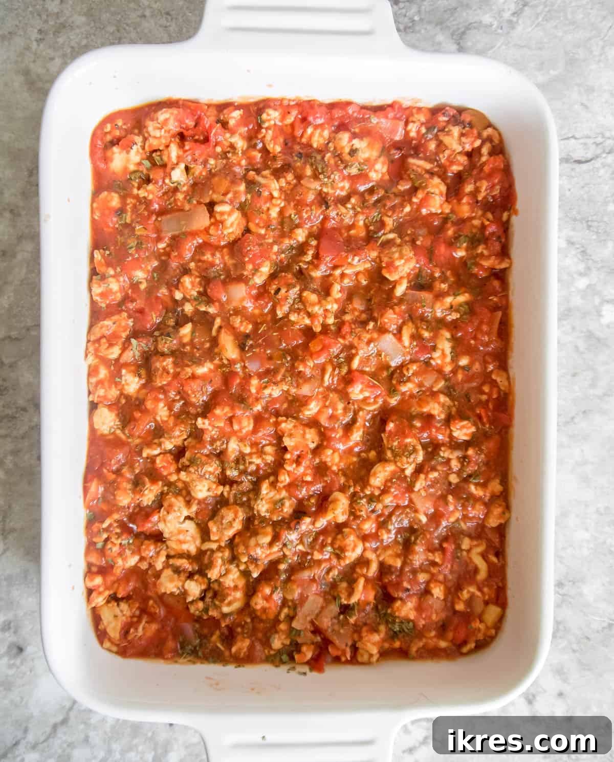 Zucchini Lasagna Reimagined: Gluten-Free, Meaty, and Mushroom Packed 6 A generous layer of rich meat sauce spread over the zucchini slices in the baking dish.