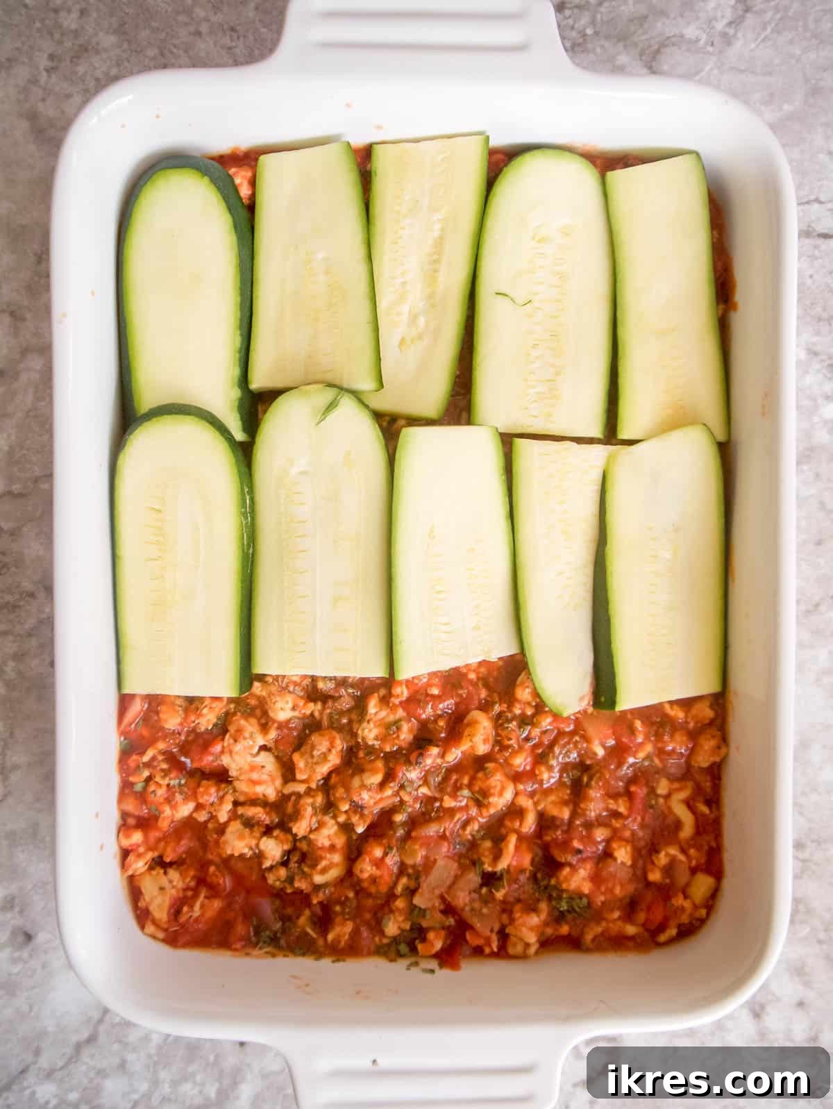Zucchini Lasagna Reimagined: Gluten-Free, Meaty, and Mushroom Packed 7 Another layer of fresh zucchini slices carefully placed over the meat sauce and cheese mixture.