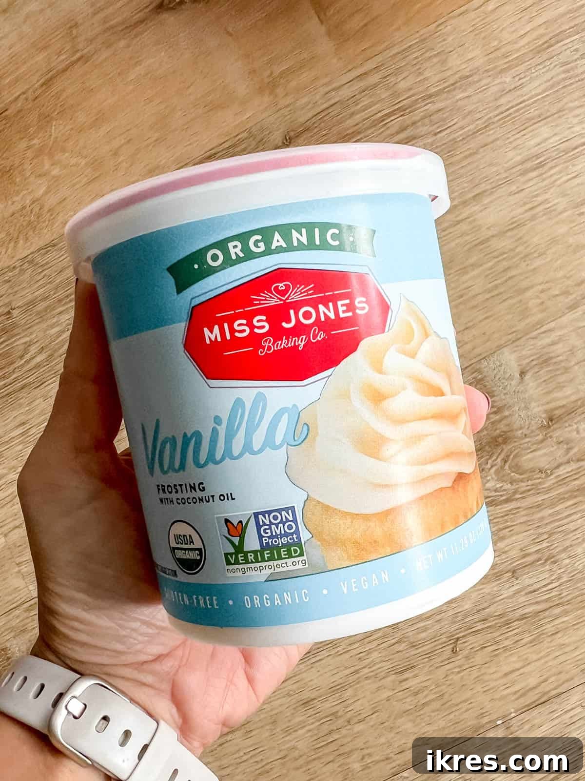 A tub of store-bought frosting, representing a convenient and tasty decorating option.