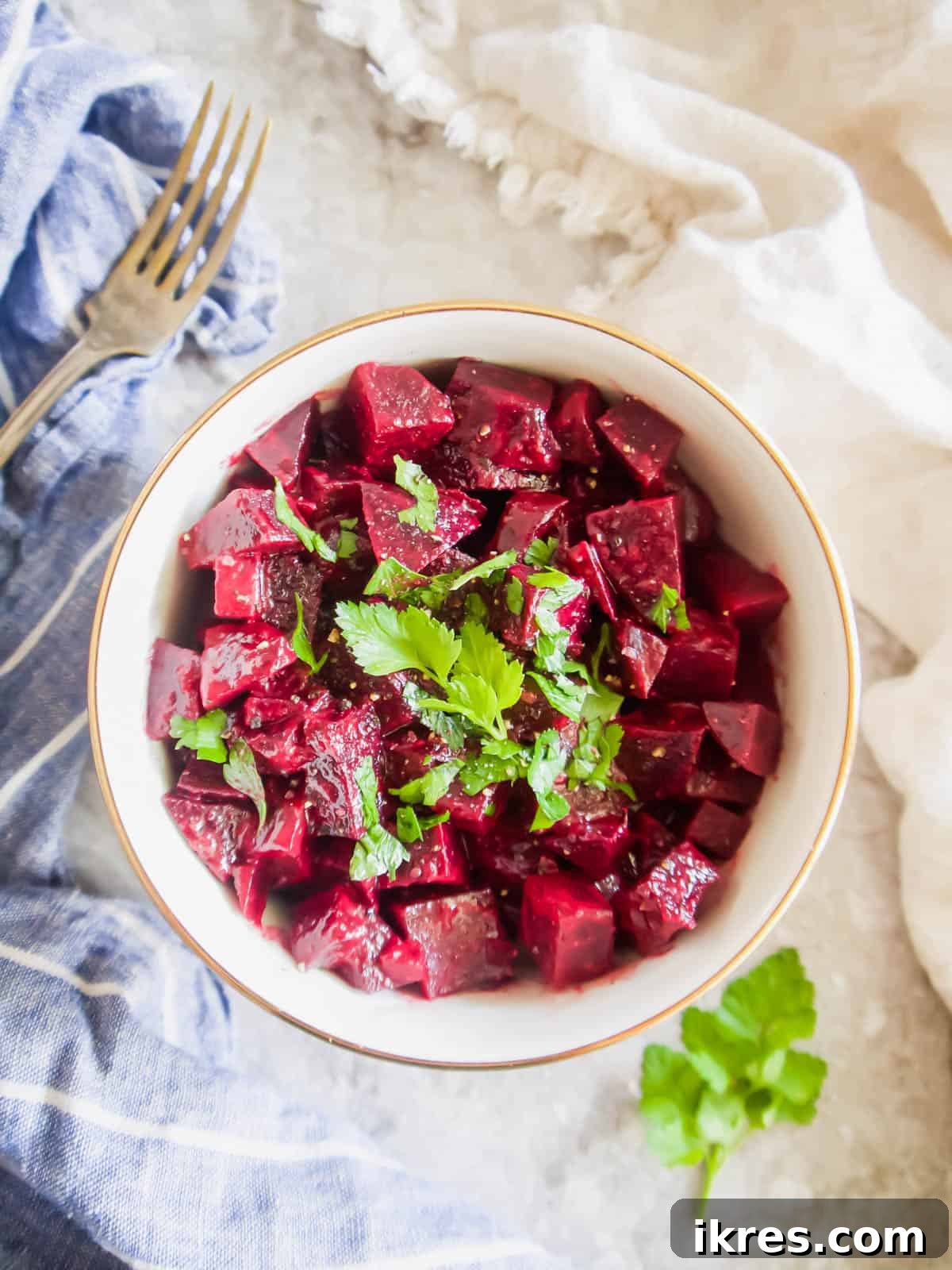 Provencal Beet Salad with Tangy Mustard Vinaigrette 4 A simple yet elegant beet salad presented in a clean white bowl, showcasing the vibrant color of the beets.