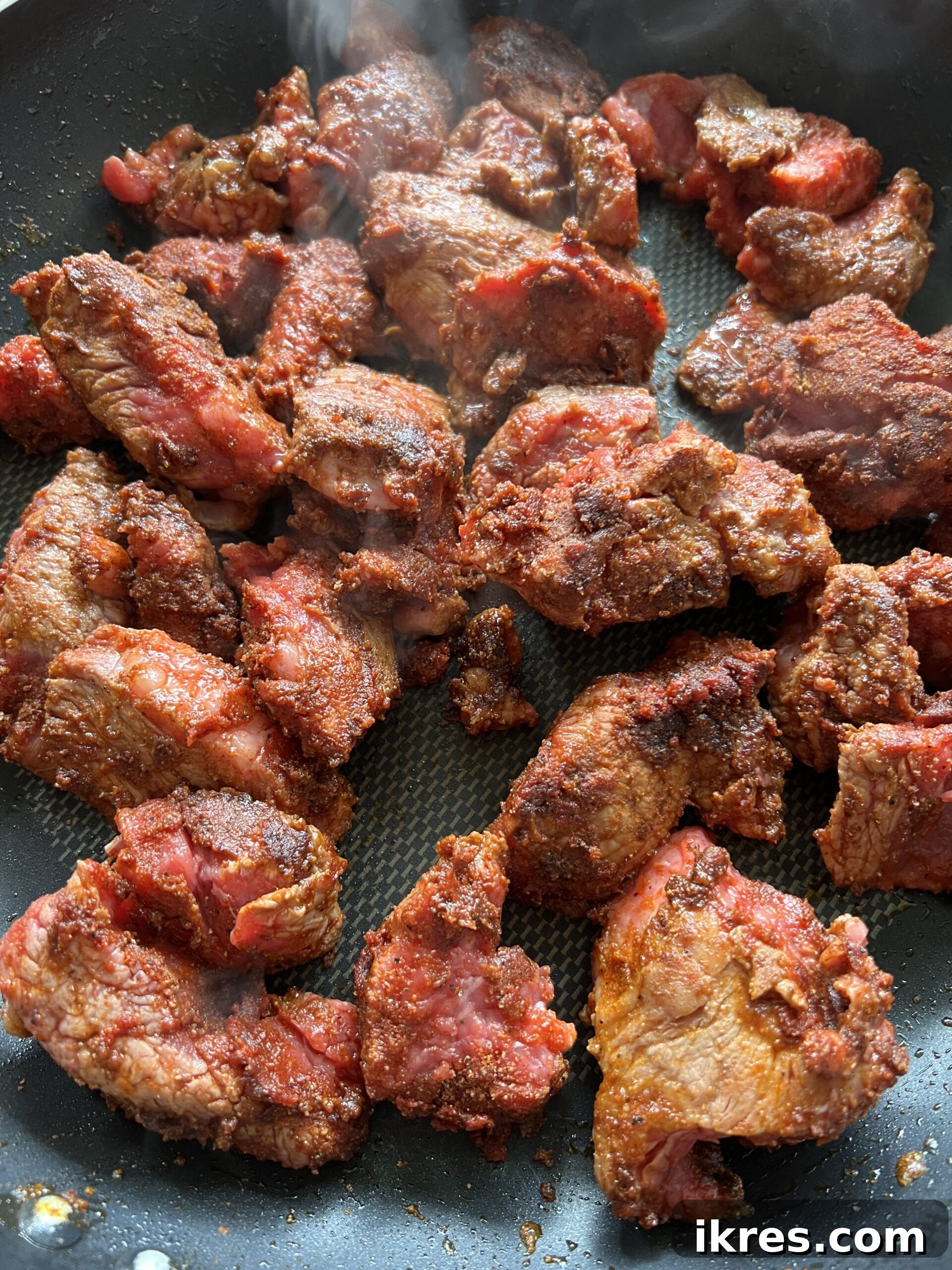 Nourishing Creamy Beef Stew with Kale and Tomato Paleo Gluten Free 5 Seared meat in frying pan.
