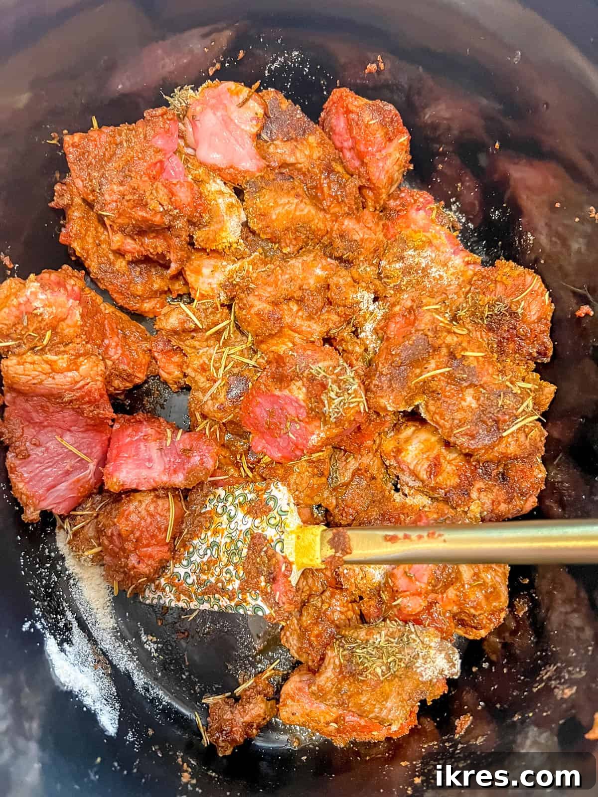 Nourishing Creamy Beef Stew with Kale and Tomato Paleo Gluten Free 6 Seared meat in crockpot with coconut flour on top.