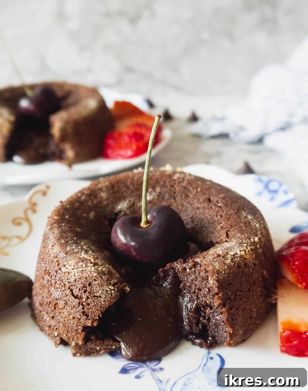 Decadent Gluten Dairy Free Molten Lava Cakes 12 A close-up shot of a Paleo almond flour molten chocolate lava cake, showcasing its rich texture.