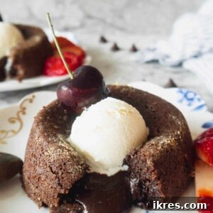Decadent Gluten Dairy Free Molten Lava Cakes 14 Gluten-free Molten Chocolate Espresso Lava Cakes with molten center falling out and ice-cream on top.