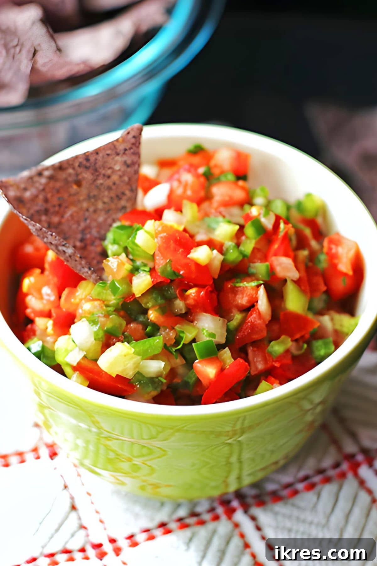 Bright & Bold Pico de Gallo: Fresh Cilantro & Tomato Salsa 6 A green bowl of salsa fresca with diced tomatoes and cilantro, beautifully presented and ready to be served.