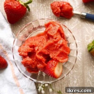 Strawberry mango sorbet in a cup.