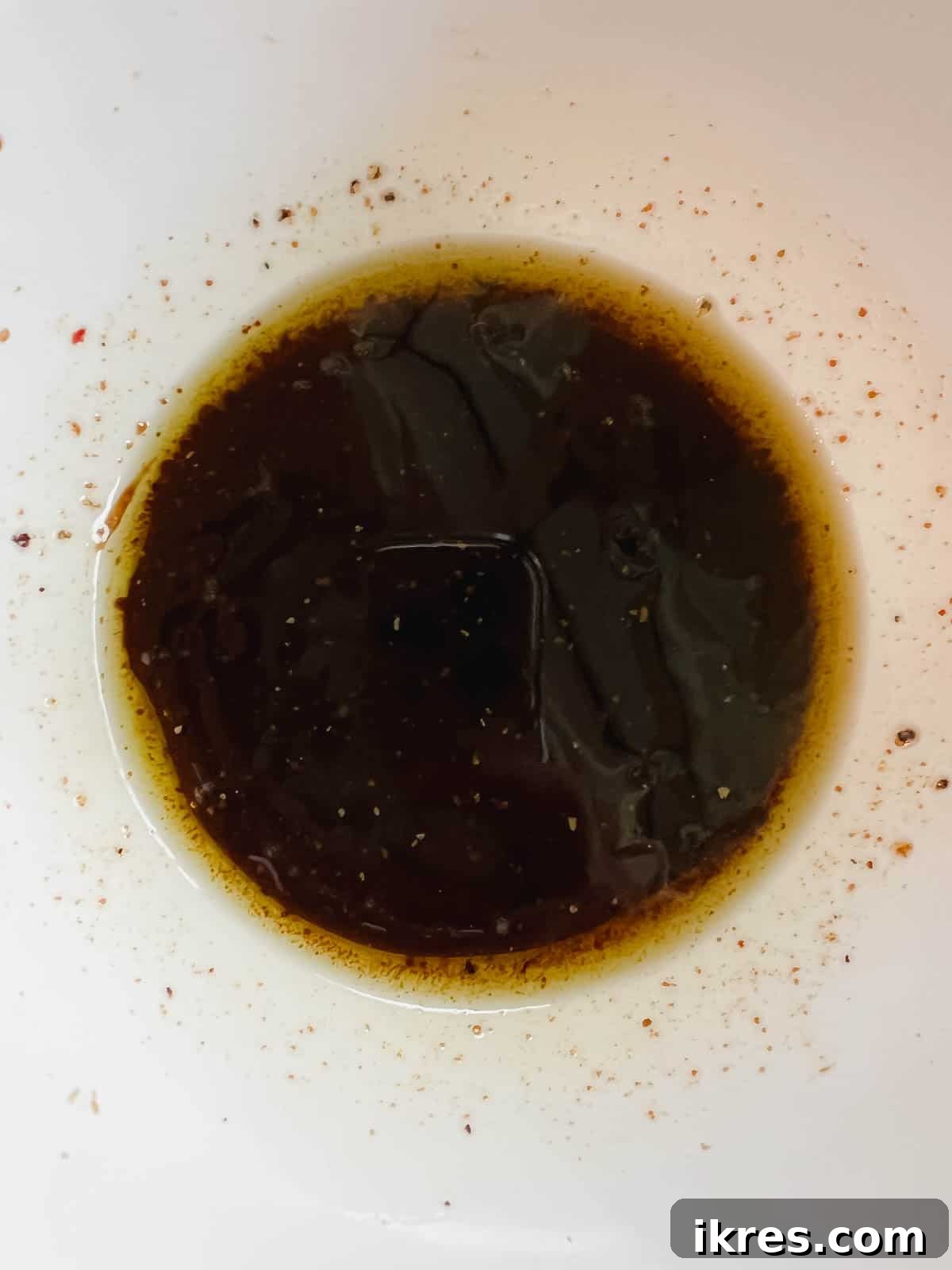 Power-Packed Kale Cobb Salad 9 Creamy balsamic vinaigrette dressing mixed in a small bowl, showing its smooth, emulsified texture, ready for the kale.