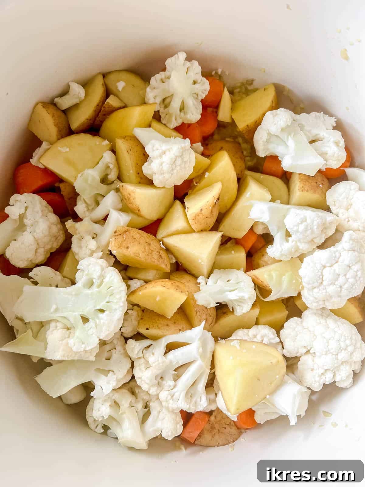 Nourishing Grain-Free Chicken Soup 5 Chopped potatoes, carrots, and cauliflower florets added to the soup pot with the sautéed aromatics, ready for the next step.