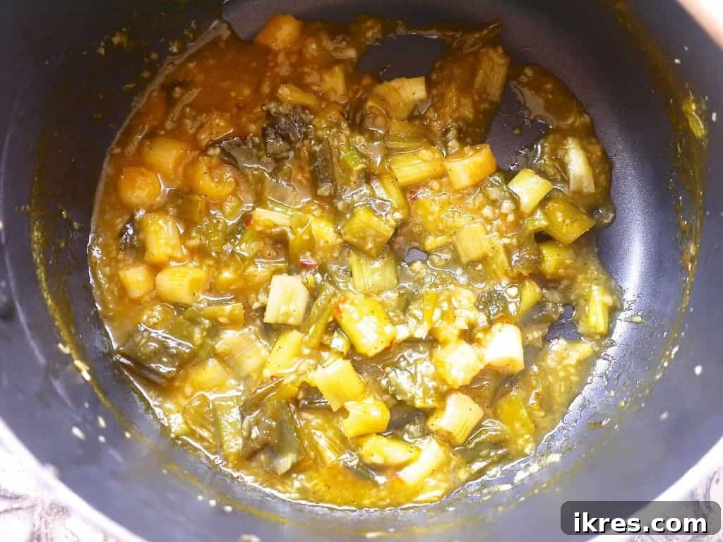 Orange sauce simmering on the stove.