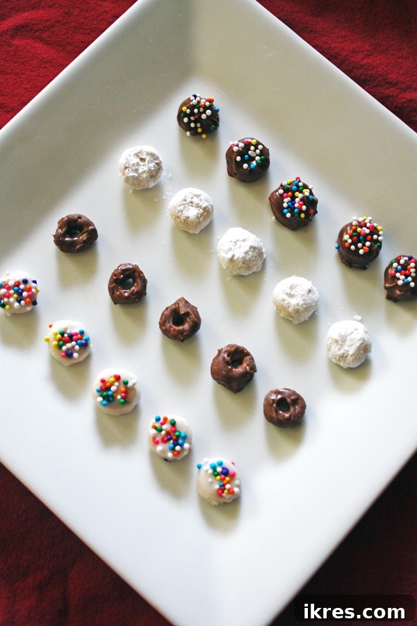 Elven Delights 9 A delightful plate of finished Elf Donuts, featuring both powdered sugar and chocolate varieties, ready for festive enjoyment.