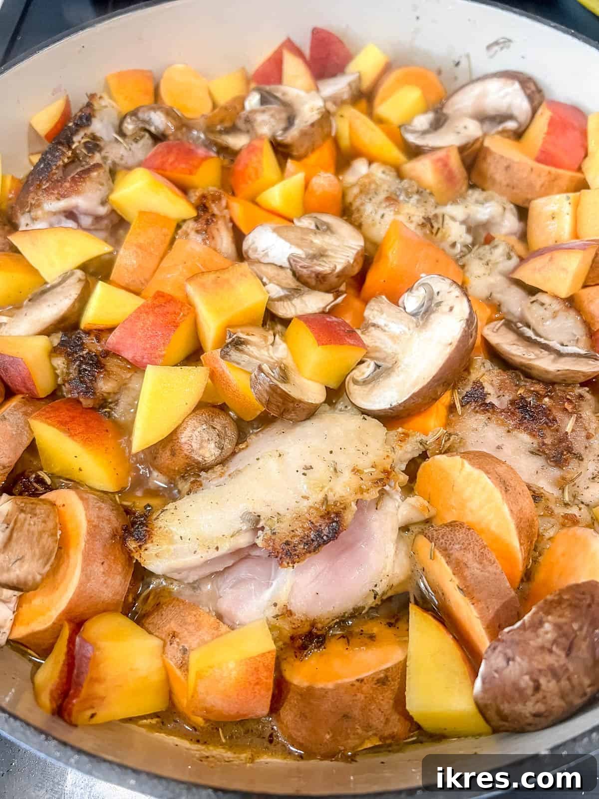 Sticky Maple Peach Chicken Thighs in a Dutch Oven 9 Boiling the dutch oven chicken thighs for a few minutes.