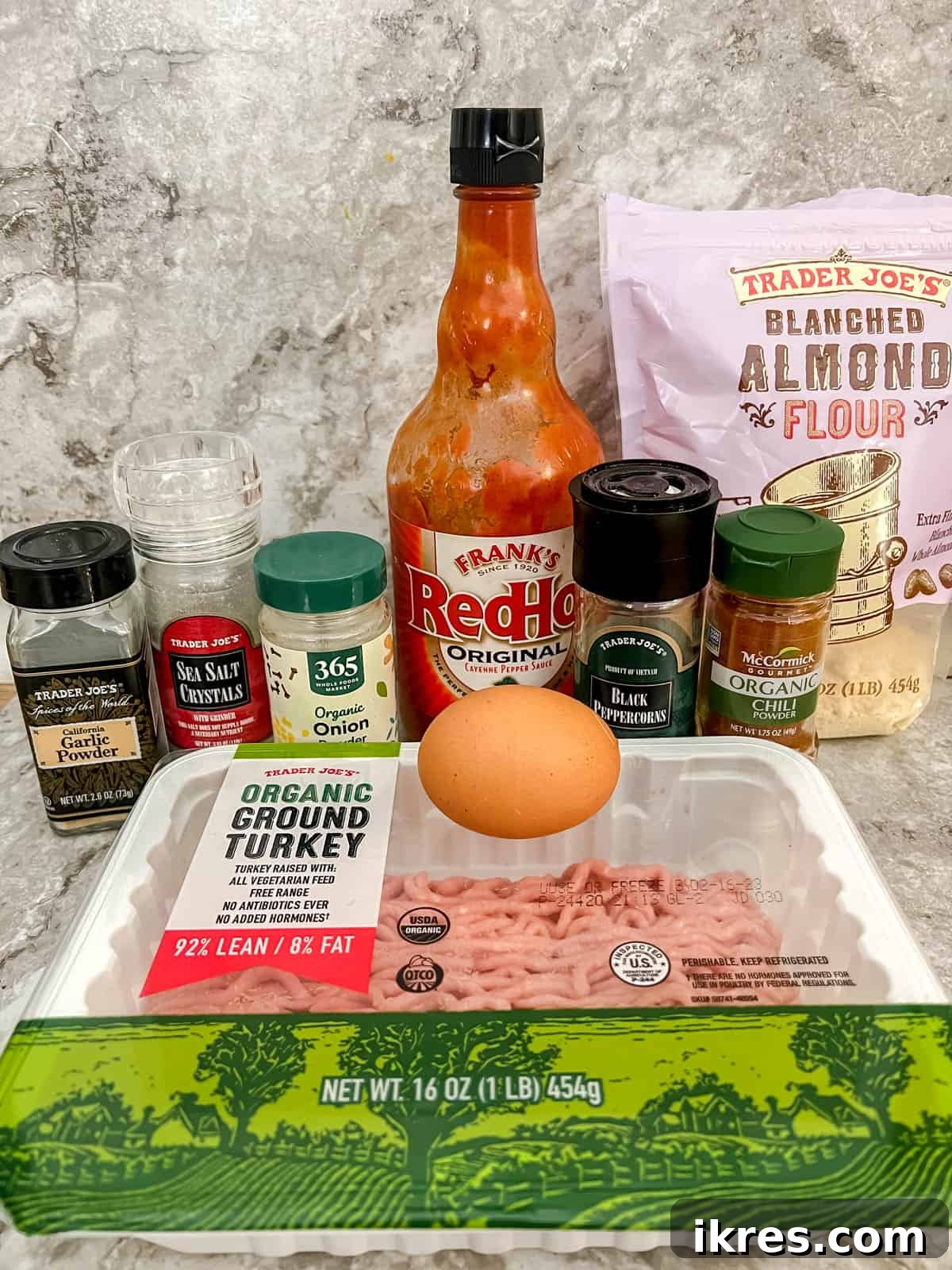 Guilt-Free Buffalo Turkey Meatballs: Your Paleo Whole30 Favorite 4 A flat lay of all the fresh ingredients needed to make healthy buffalo turkey meatballs, including ground turkey, hot sauce, almond flour, and various spices.