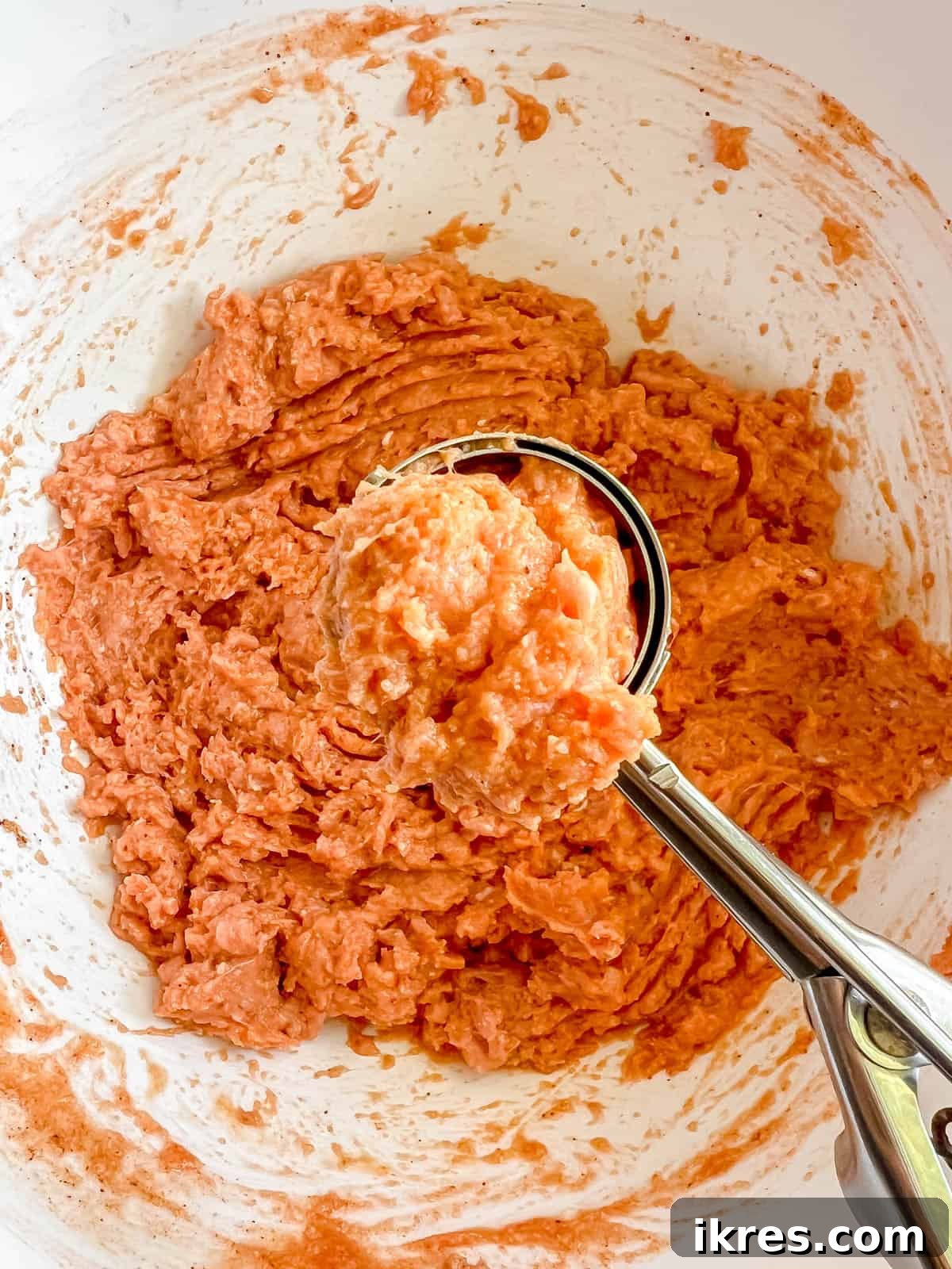 Guilt-Free Buffalo Turkey Meatballs: Your Paleo Whole30 Favorite 6 Buffalo turkey ingredients mixed and portioned into balls on a baking sheet, ready for the oven.