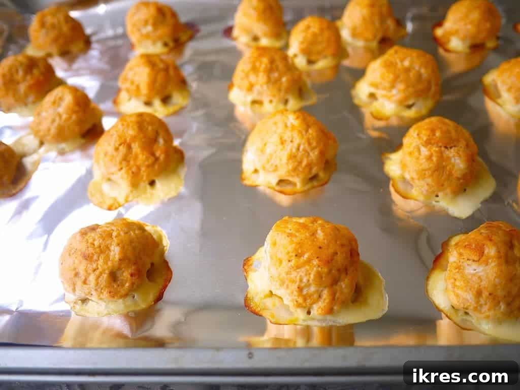 Guilt-Free Buffalo Turkey Meatballs: Your Paleo Whole30 Favorite 7 Healthy buffalo turkey meatballs freshly baked and slightly browned on a baking sheet.