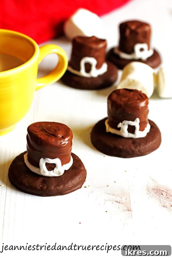 Pilgrim Hat Thanksgiving Treats 2 Festive Pilgrim Hat Cookies sitting on a white table next to a glass of milk, ready for Thanksgiving dinner.
