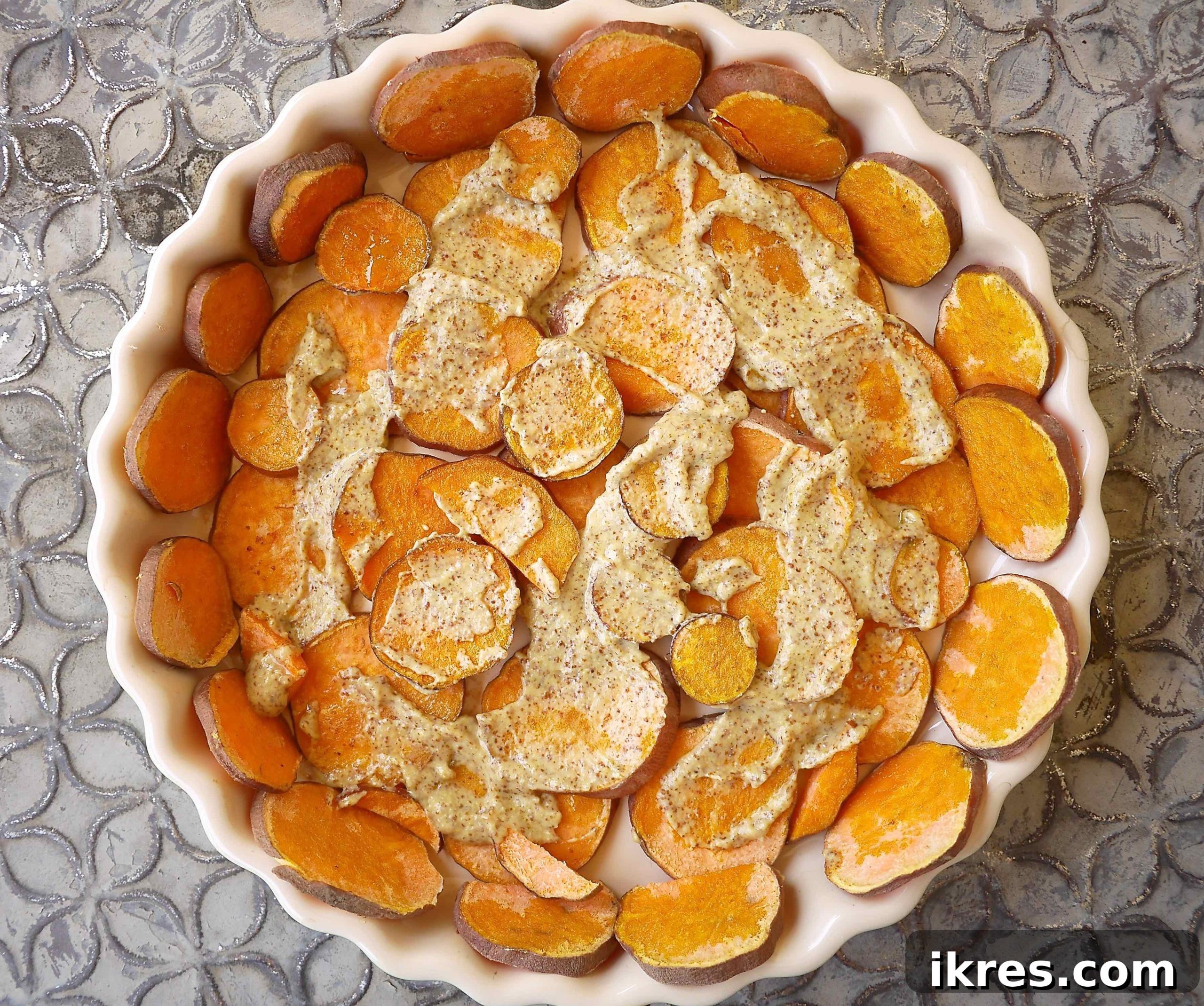 Flavorful French Tuna and Tomato Quiche on a Golden Potato Crust 4 A layer of tangy mustard evenly spread over the pre-baked sweet potato crust.