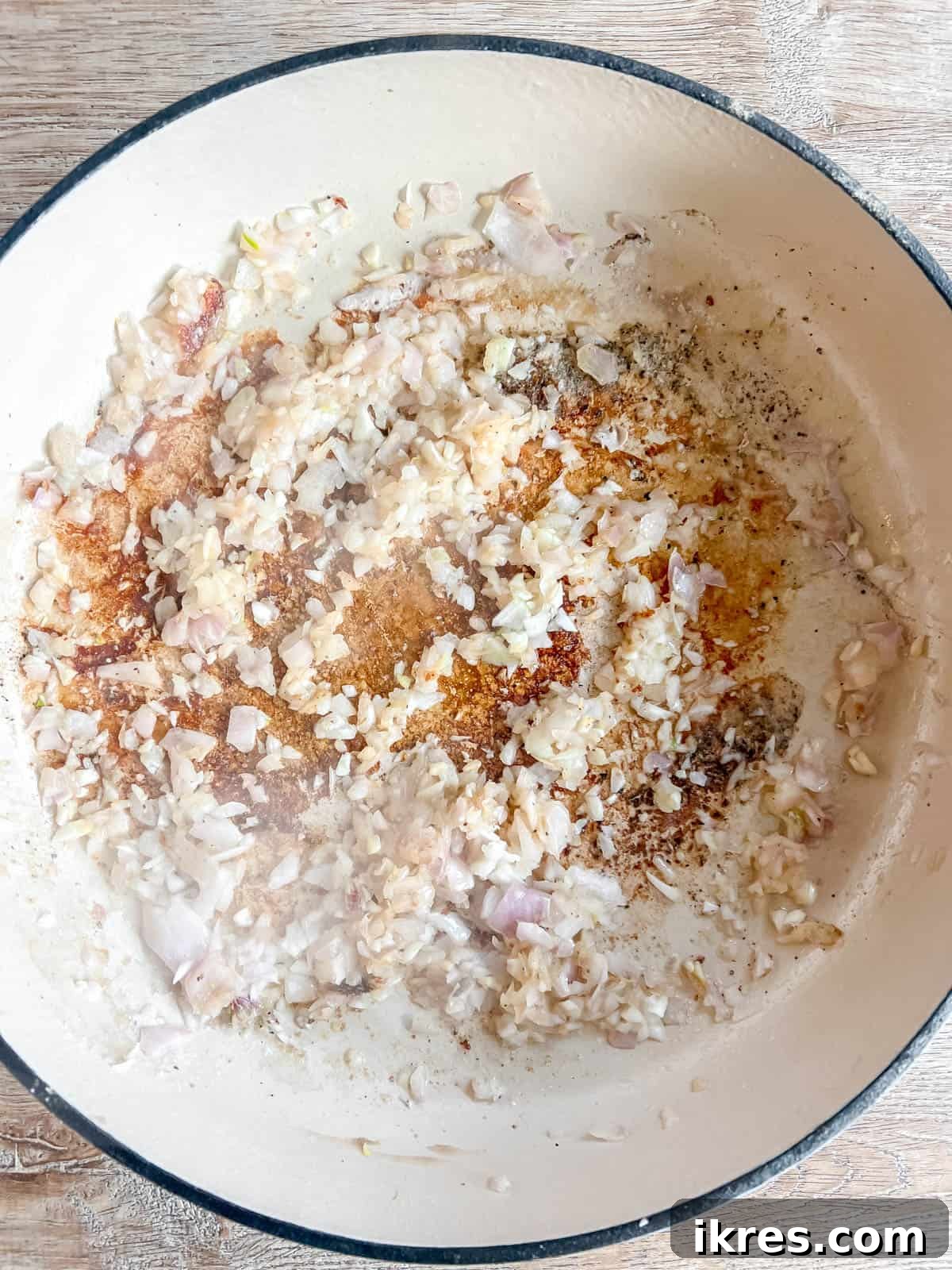 Sweet and Savory Dutch Oven Pork Tenderloin with Apples and Figs 5 Sautéing minced shallots and garlic in a Dutch oven until fragrant.